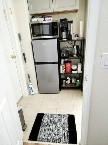 a kitchen with a white refrigerator and a microwave at Beautiful All Private GuestSuite in Lancaster