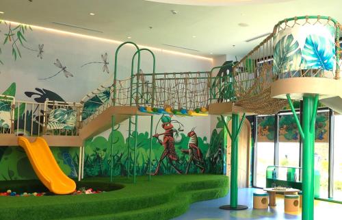 a childrens play area with a slide and a staircase at TTC Van Phong Bay Resort - Himalaya Sauna & Steam Retreat Included in Ninh Hòa