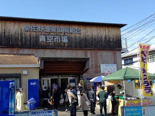 a group of people standing outside of a building at REF Kansai Airport by VESSEL HOTELS in Izumi-Sano