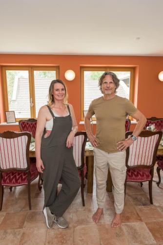 a man and a woman standing in a room at Naturparkbauernhof Pöltl in Pöllau