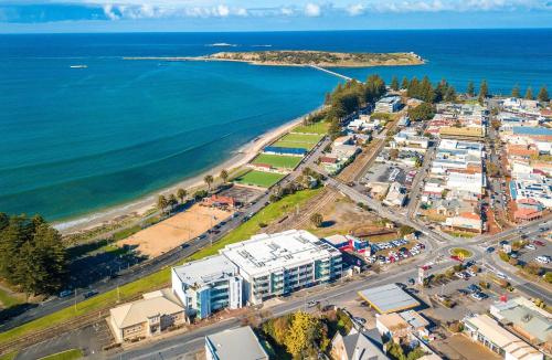 an aerial view of a resort near the ocean at Relax in Style Comfort in Victor Harbor