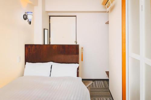 Postel nebo postele na pokoji v ubytování Van Cort Landt Hotel