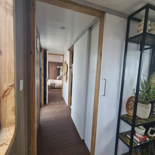 a hallway leading to a room with a hallway at Elephant lodge in Kwa Kuchinia