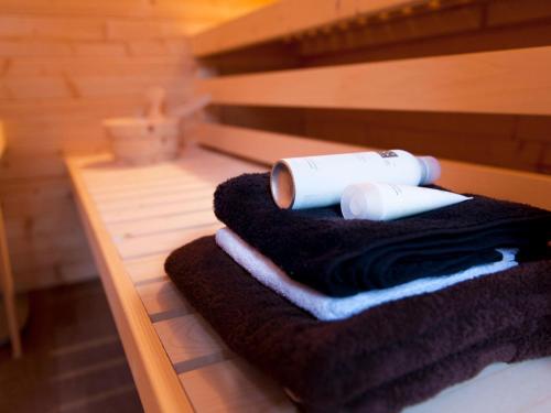 a pile of towels and a roll ofadobe at Spacious Retreat, Vlagtwedde in Vlagtwedde