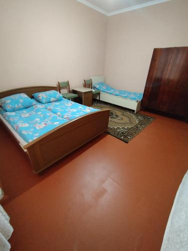 A bed or beds in a room at Hostel ucuz