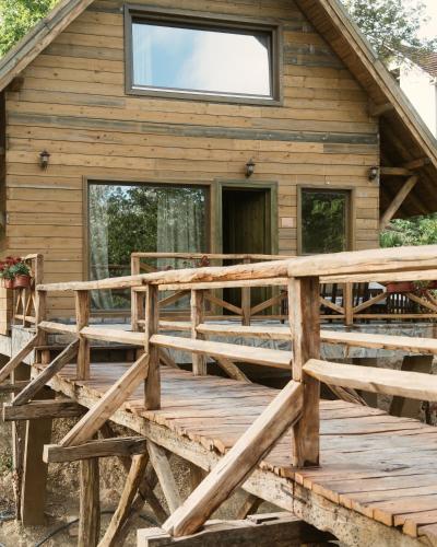 a wooden deck in front of a cabin at Eko Zaseok Brana in Rekovac