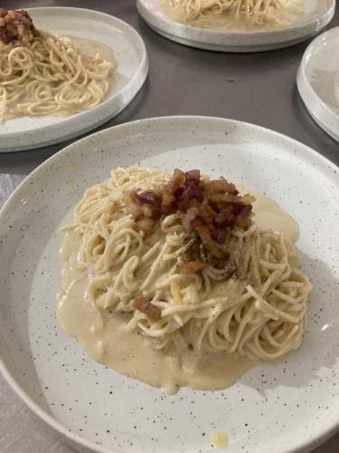 a plate of pasta with sauce on a table at The Rascals Kite Resort in Kalpitiya