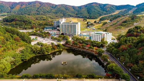 an aerial view of a city and a lake at Wellihilli Park Resort in Hoengseong