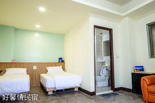 Ein Bett oder Betten in einem Zimmer der Unterkunft 好馨情民宿