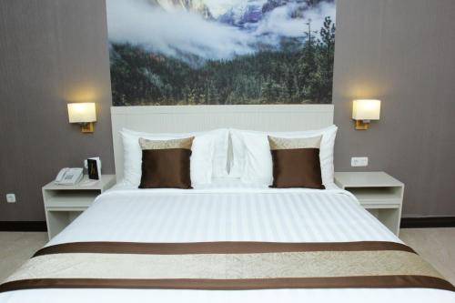 Un pat sau paturi într-o cameră la Horison abepura