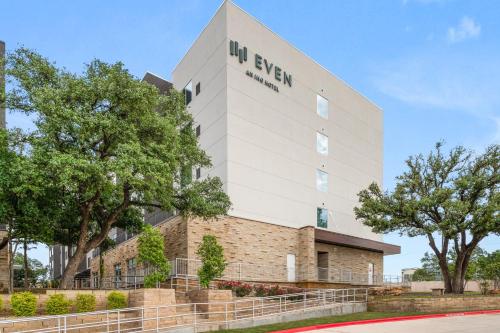 a building with the university of exeter sign on it at EVEN Hotel Austin Uptown near the Domain by IHG in Austin