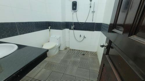 a bathroom with a toilet and a sink at Homestay Fairy's House in Ho Chi Minh City