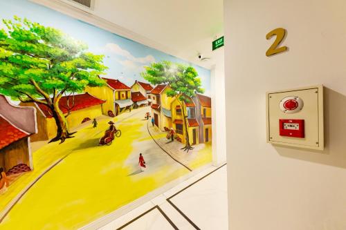 a painting on a wall in a room at 3T Hotel Hanoi in Hanoi