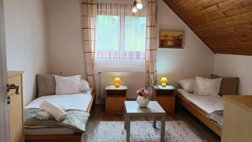 Postel nebo postele na pokoji v ubytování Marianna Apartman