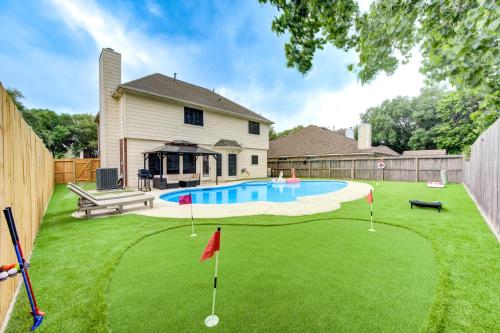 a backyard with a putting green and a pool at Amazing Getaway Home - 4 Bedrooms 2,5 Baths - West Houston, Katy, Richmond - Huge Pool, Mini-Golf, PingPong, Billards, BBQ, Katy Asian Town, Typhoon Waterpark, King Bed in Katy