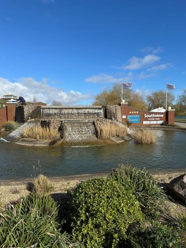a river with a bridge in the middle at LOIRE in Skegness