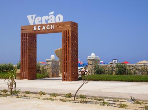 a sign that says vagon beach in front of a building at Lasirena north coast Chalet With Roof , 3 rooms in Zāwiyat ‘Abd al Mun‘im