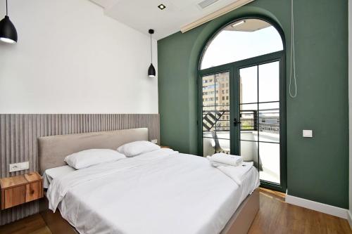 En eller flere senge i et værelse på Sunlight studio 4