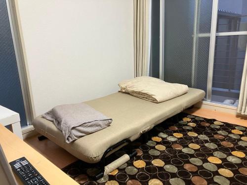 Cocone house Ohoriparkにあるベッド