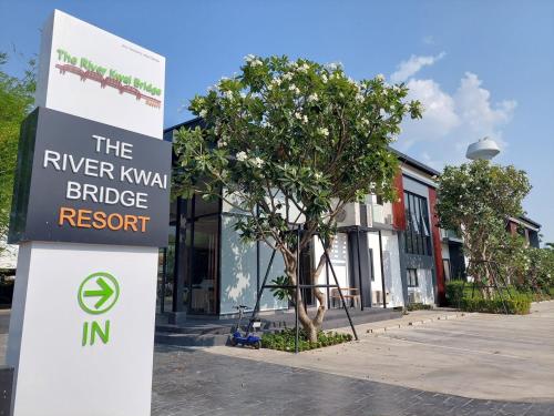 a sign that reads the river kiwi bridge resort at The RiverKwai Bridge Resort 2 in Ban Chuk Kum
