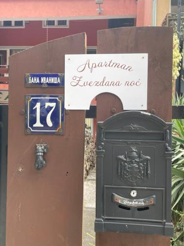 a mailbox next to a box next to a sign at Zvezdana noc in Zvezdara