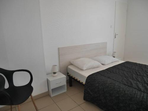 En eller flere senge i et værelse på La petite boulangère de pays