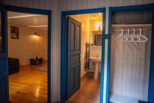 an open door to a bathroom with a sink at Villa Sara in Sinaia near Peles & Gondola in Sinaia