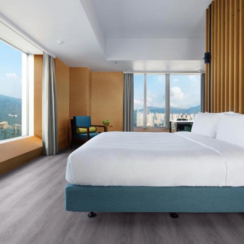 Una cama o camas en una habitación de Nina Hospitality