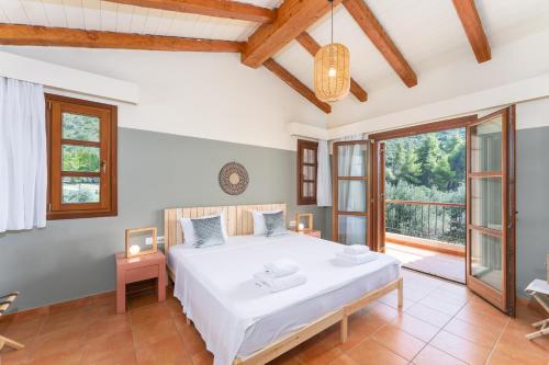 Postel nebo postele na pokoji v ubytování Kaminos Evia