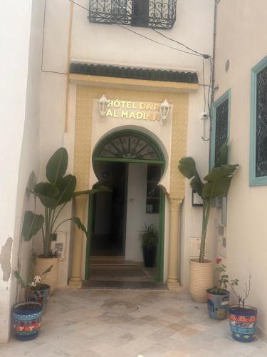 a building with a sign that reads world day cal marilyn at Hotel Dar Al Madina in Mahdia