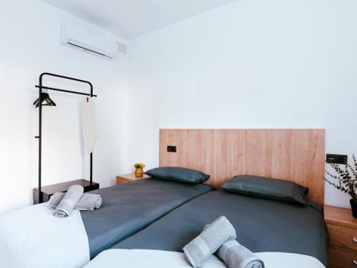 a bedroom with a large bed with two pillows at New in front of Víctor Villegas Auditorium & FICA in Murcia