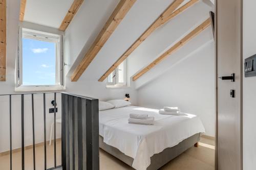 Posteľ alebo postele v izbe v ubytovaní Tiny Secret House