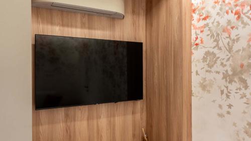 a flat screen tv hanging on a wall at Amatera Luxury Apartments in Matera