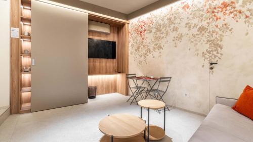 a living room with a couch and a table at Amatera Luxury Apartments in Matera