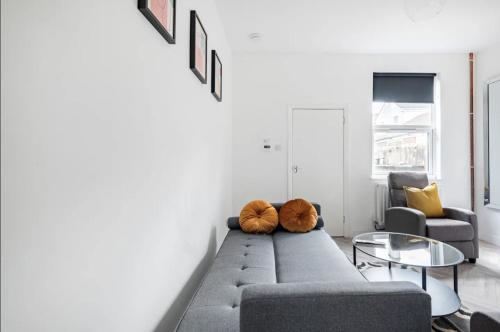 a living room with a couch and two chairs at Home Away From Home Local To A Lot Of Amenities in Stoke on Trent