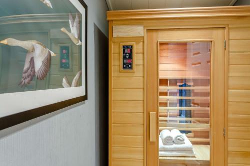 a walk in closet with a wooden cabinet at Blenheim Lodge in Kingham