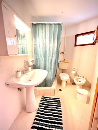 a bathroom with a sink and a toilet and a shower at Oelia Rooms & Apartments in Agia Marina Aegina