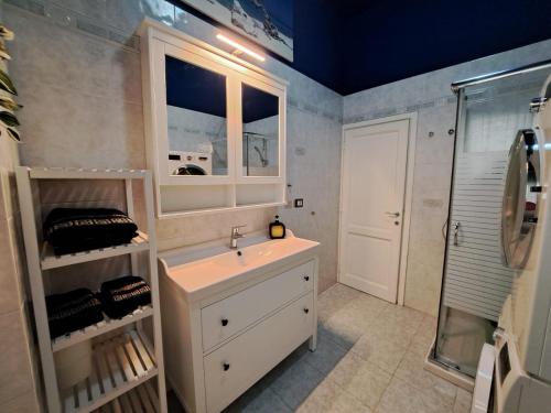 a bathroom with a sink and a shower at ViaGiotto Guest House in Certaldo