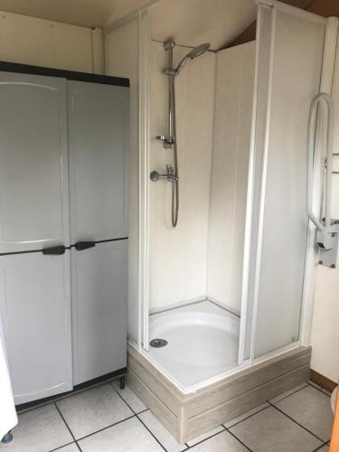 a bathroom with a shower and a shower stall at Goolderheide De Bochel 542 in Bocholt