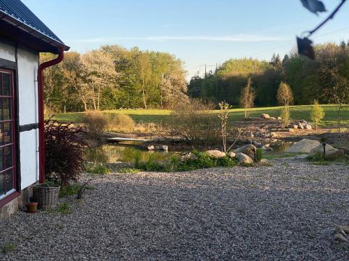 a view of a river from the side of a house at Rönnebröd Guesthouse in Rönnebröd