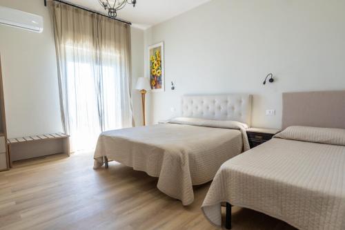 Ένα ή περισσότερα κρεβάτια σε δωμάτιο στο IG- "Talìa Apartments"