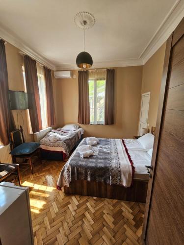 Postel nebo postele na pokoji v ubytování Shota's Guest House