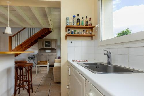 a kitchen with a sink and a counter top at Villa Julien in Saint-Julien-en-Born