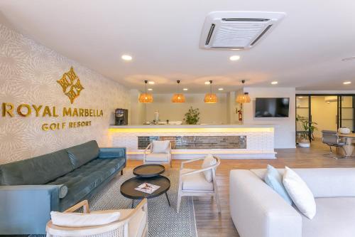 a lobby of a hotel with a couch and chairs at Royal Marbella Golf Resort in Estepona
