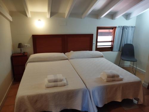 Katil atau katil-katil dalam bilik di Hostal Bordillas