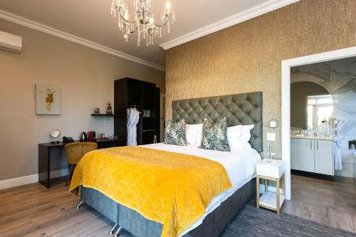 En eller flere senge i et værelse på Cloud 9 Boutique Hotel and Spa