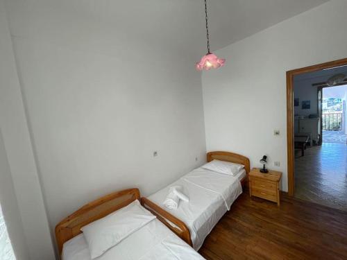 Postel nebo postele na pokoji v ubytování Dafnis beach house