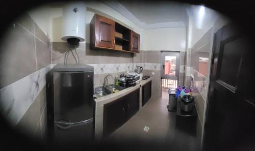a kitchen with a sink and a counter top at Appartement Tout Confort en Centre Ville de Kaloum in Conakry