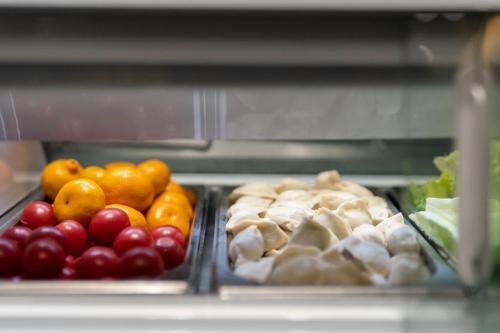 a drawer filled with different types of fruits and vegetables at Shanghai Pudong Xiangguo Hotel in Shanghai
