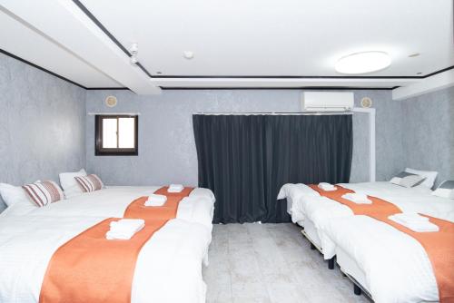 En eller flere senge i et værelse på Maison D'or